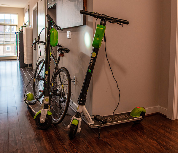 E-Scooters charging in a hallway